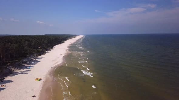 Drone footage of a sandy beach, sunny summer day, Baltic Sea, Poland, Lubiatowo. alt
