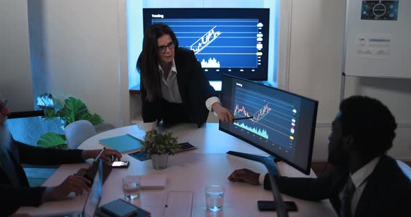 Business woman explaining trading strategies inside bank meeting room alt