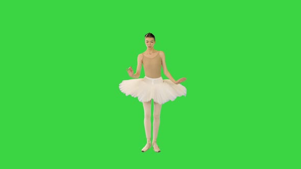 Young Ballerina Walks Demipointe Raising Arms on a Green Screen Chroma Key alt