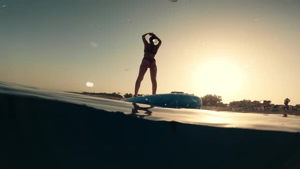Body Stretching on a Surf Board alt