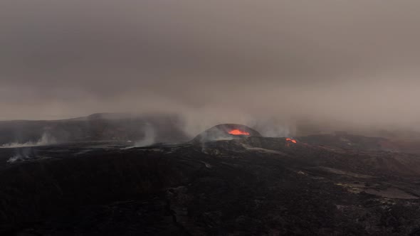 Distant View Of Volcanic Eruption Against Overcast Sky. - Wide Shot alt