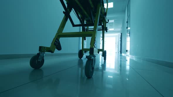 Rolling Table Is Riding Along the Hospital Hallway alt