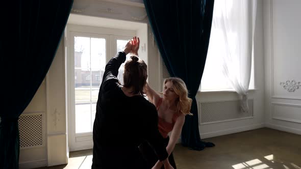 Young Man and Woman are Rehearsing Contemporary Choreography Couple is Dancing alt