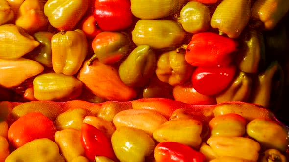 Bell peppers. Salad bell pepper packing bag. Market background.