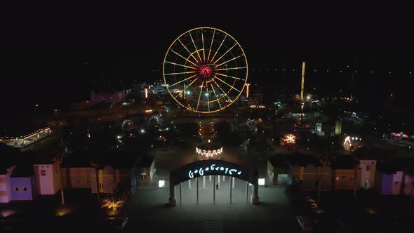 Flying over Amusement Park Tsitsinatela at night. Shekvetili, Georgia 2020 alt