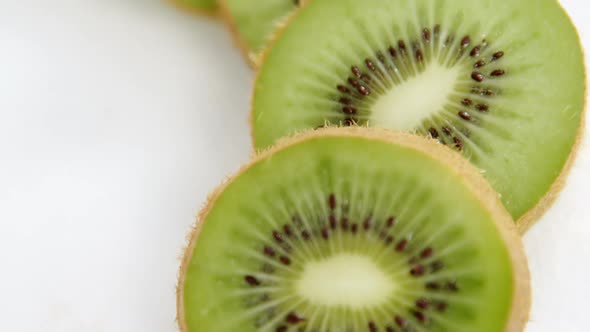 Kiwi slices on white background alt