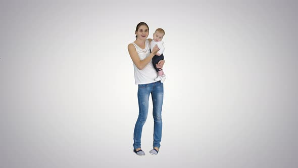 Happy Mom and Cute Kid Baby Son Waving Hands Saying Hi To Camera, Alpha Channel alt