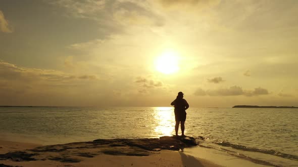 Lady sunbathing on tropical seashore beach time by clear water with clean sandy background of the Ma alt