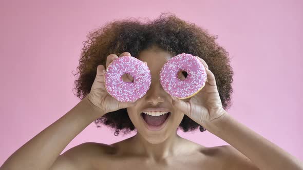 Professional African American Model Poses Holding Doughnuts alt