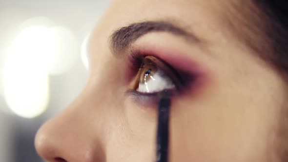 Close Up Slightly Unfocused Footage of Applying and Blending in Eyeshadows alt