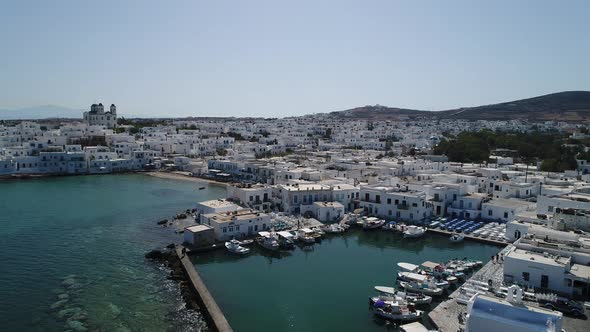 City of Naoussa on Paros island in the Cyclades in Greece seen from the sky alt