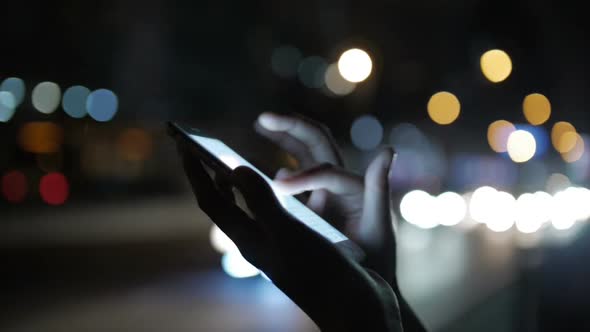 Women Using Cellphone At Night alt