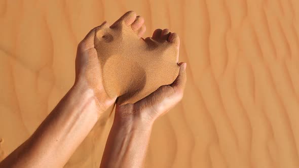 Sand Running Through Hands