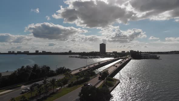 Sundown drone flight toward the yachts in Sarasota, Florida.  Breathtaking John Ringling causeway tr alt