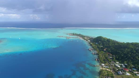Aerial drone view of a luxury resort and overwater bungalows in Bora Bora tropical island alt