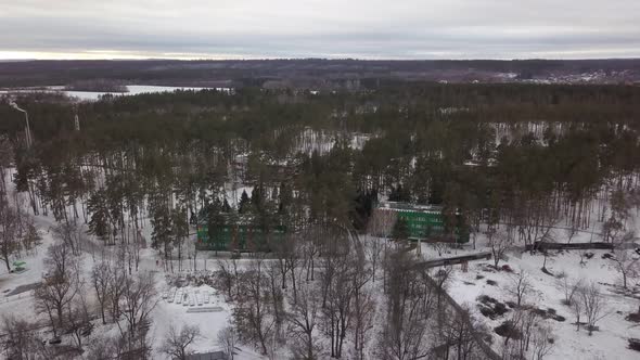Buildings of Recreational Touristic Lodge in Woodland in Winter Day, Aerial Shot