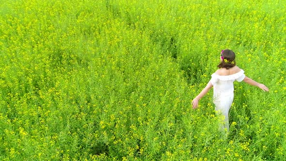 Happy Woman in Rape Field alt