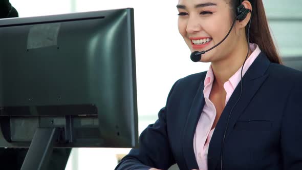 Business People Wearing Headset Working in Office alt
