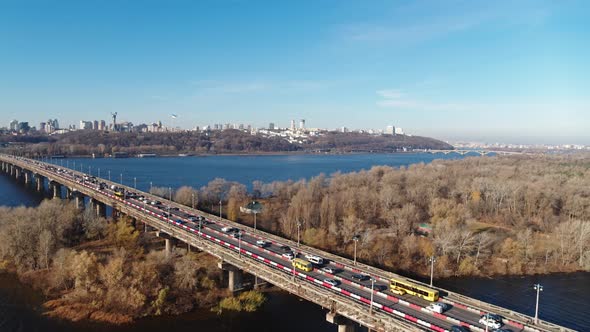 The Patona Bridge Car Traffic at the Autumn Time Bare Trees Without Leaves Aerial View alt