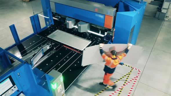 Top View of Aluminum Getting Loaded Into the Shearing Machine alt