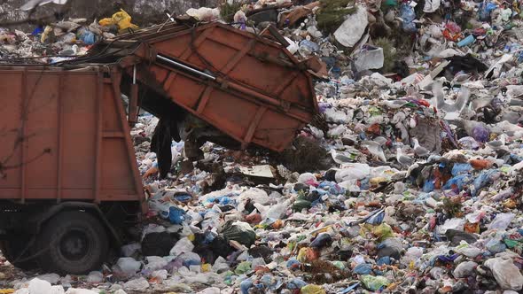 Garbage truck scatters garbage.