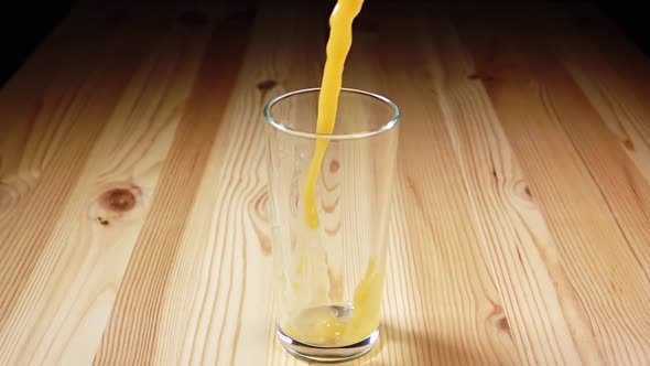 Juice is Poured into a Glass