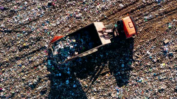 Truck Unloading Garbage Waste at Landfill Junkyard alt