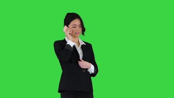 Business Woman Dancing After Making a Successful Call on a Green Screen, Chroma Key alt