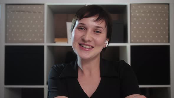 Video chat concept. Smiling young adult woman look at camera talk make live video conference call. alt