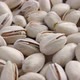 Close-up of salted unpeeled pistachios. - VideoHive Item for Sale