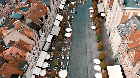 Leuven Oude Markt, tree-shaded town square lined with open-air bars and restaurants alt