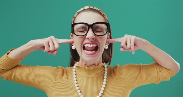 Woman closing her ears with her fingers and not listening