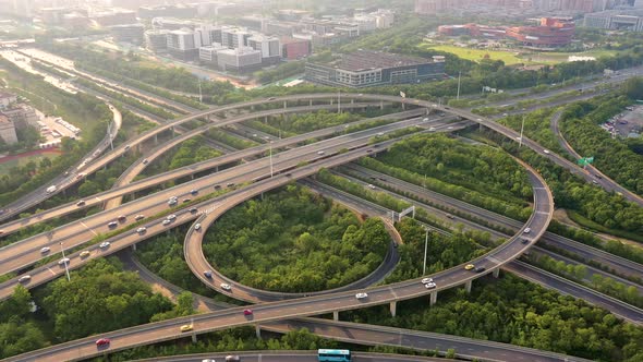 Aerial view of highway and overpass in city alt
