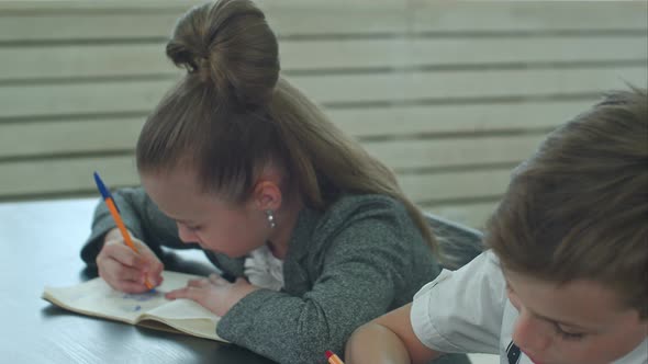 Group of Hispanic Students in Class at School During Lesson alt