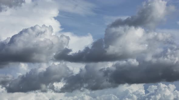 Fast moving time lapse of dramatic clouds in mid afternoon. Weather is typical of summer in the trop alt