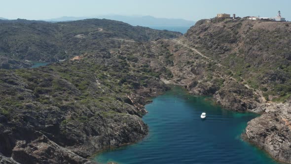 Aerial View of Small Beach Among Rocks of Cape alt