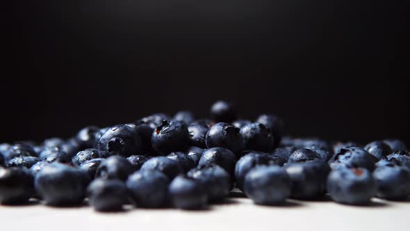 Bunch with Juicy Blueberry on the White Surface