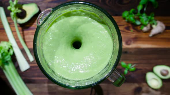 Fresh Green Smoothie in a Blender. The concept of Proper Nutrition for a Healthy Life. alt