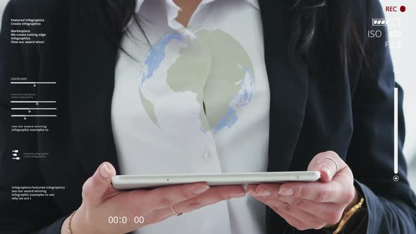 Planet Earth on a Virtual Tablet Screen. Close-up Girl in a Suit Holds a Tablet and Presses on It