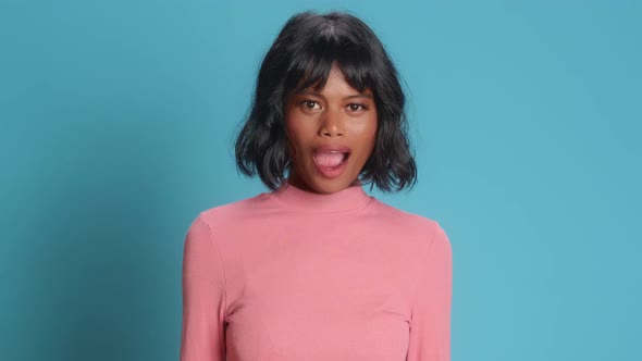 Amazed Woman Looks with Surprised Cheerful Expression at Incredible Says Wow alt