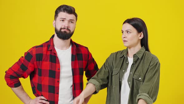 Couple of Young People Standing Back to Back alt