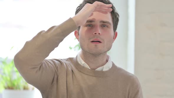 Portrait of Man Looking Around Searching alt
