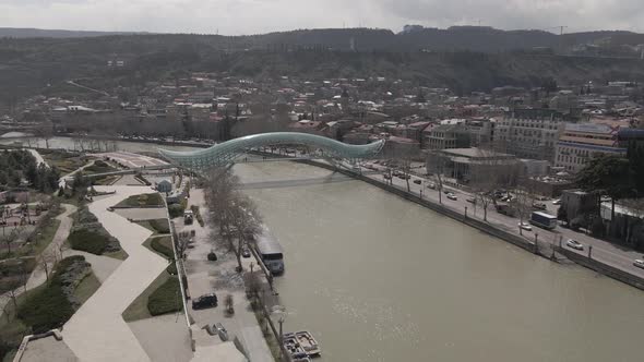 Tbilisi, Georgia - April 2 2021: Aerial view of Tbilisi city central park and Bridge of Peace. alt