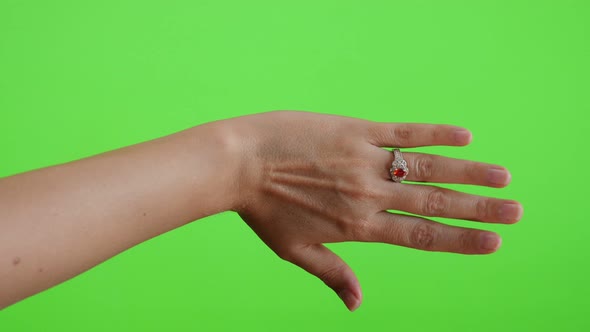 Trying new ring in front of green screen chroma key background 4K 3840X2160 UltraHD footage - Greens