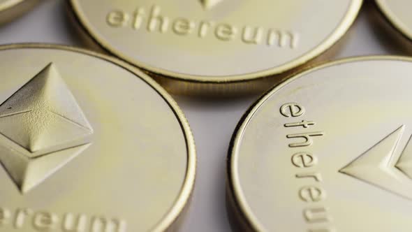 Rotating shot of Ethereum Bitcoins (digital cryptocurrency) - BITCOIN ETHEREUM alt