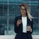 Young confident Businesswoman browsing Cellphone near modern Business Building - VideoHive Item for Sale