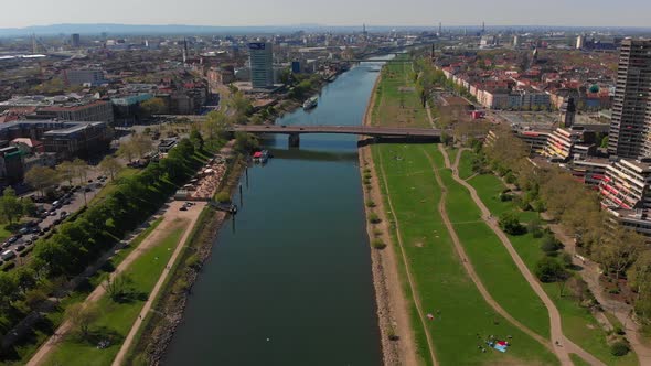 Top view of the embankment of the Neckar River. Bridges, TV tower, green grass and trees. alt