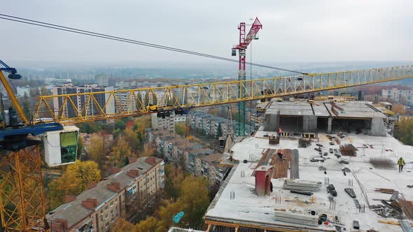 Construction of a residential apartment complex. Multi-storey building under construction. alt