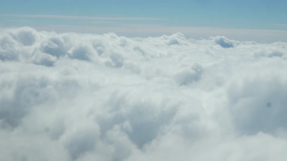 The View From the Airplane Window is a Thick Layer of White Clouds