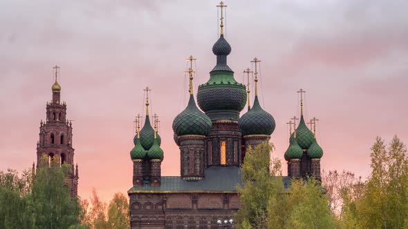 View of the Church of St. John the Baptist in Yaroslavl in front of pink sunset.